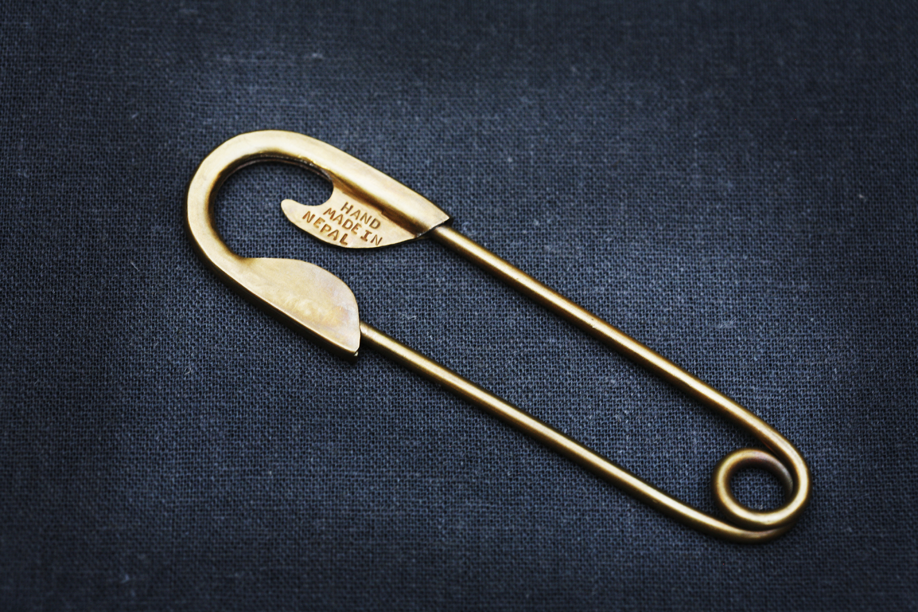 Giant gold safety pin discount